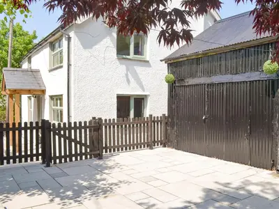 a wooden fence in front of a house at Bryn Salem in Mallwyd