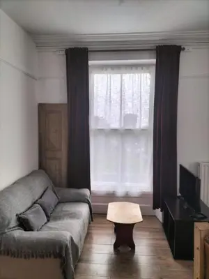 a living room with a couch and a window at Bryn Awel in Aberystwyth