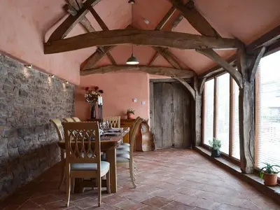 a dining room with a table and chairs at The Cart Shed in Kings Pyon