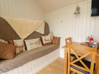 a room with a couch with pillows on it at Hillside View in Saint Harmon