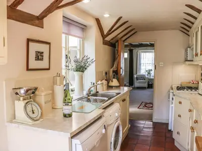 a kitchen with a sink and a counter at Garden Cottage in Ludlow