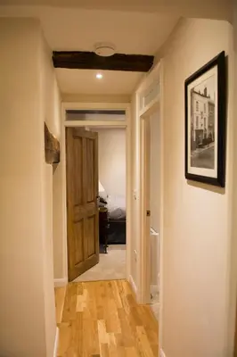 a hallway with a door leading to a bedroom at 138a Old Star & Garter in Ludlow