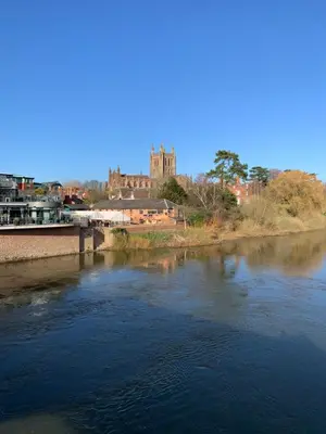 a view of a river with a castle in the background at The Hayloft, Wall End Farm in Leominster