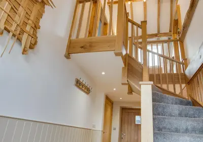 a staircase in a house with wooden beams at 3 Bed in Bala oc-bow69 in Bala
