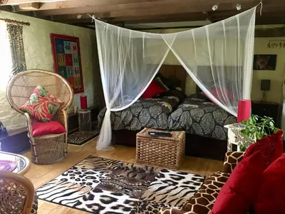 a bedroom with a bed with a canopy at Brecon Boutique Breaks Wild Land in Sennybridge