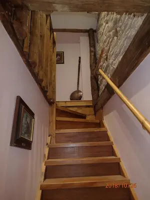 a staircase in a house with wooden ceilings at Brecon Boutique Breaks River Run in Sennybridge