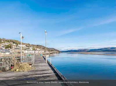 a dock with a view of a body of water at Sunny Shores in Aberdyfi