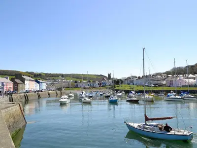 a group of boats docked in a harbor at Penrhiw in Llangeitho