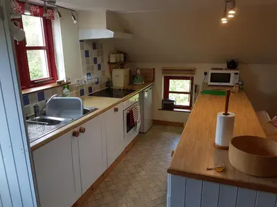 a kitchen with a sink and a counter top at Seren Loft - Cynghordy, Llandovery in Llandovery