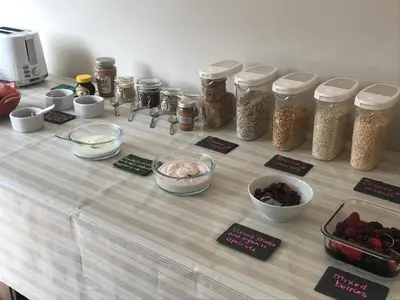 a table topped with jars and bowls of food at Nant Gloyw Oswestry in Oswestry