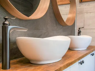 a bathroom with a white bowl sink on a counter at The Pendre Longbarn in Pentre-briwnant