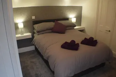 a bedroom with a bed with two hearts on it at Borthwenbnb in Dolgellau