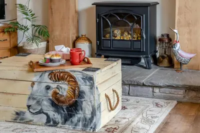 a fireplace in a living room with a stove at 2 Bed in Trallong oc-bow106 in Sennybridge
