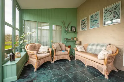 a living room with two chairs and a couch at Ty Newydd B&B in Brecon