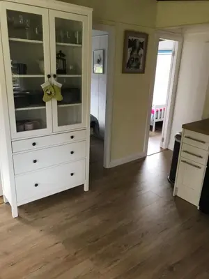 a kitchen with a white dresser in a room at Sherdale lodge in Builth Wells