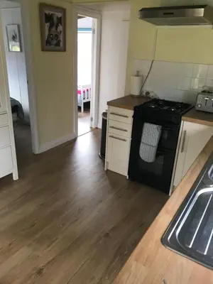 a kitchen with a stove and a sink in it at Sherdale lodge in Builth Wells