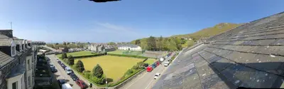 an aerial view of a city with a green park at 3 Park View in Barmouth