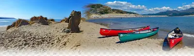 three boats sitting on the sand on a beach at 3 Park View in Barmouth