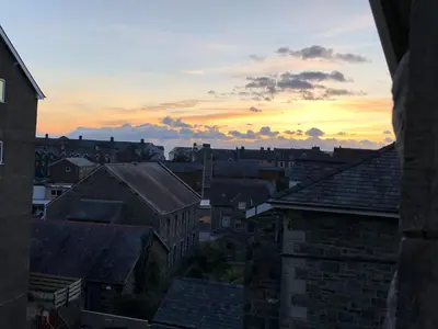 a view of a city at sunset at 3 Park View in Barmouth