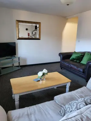 a living room with a coffee table and a couch at The Stores in Aberystwyth