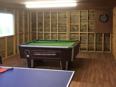 a room with a pool table in a room with shelves at Upper Close - Uk10873 in Evenjobb