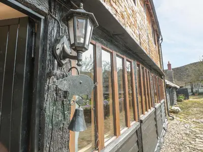 a lock on the side of a building with a window at The Granary in Hereford
