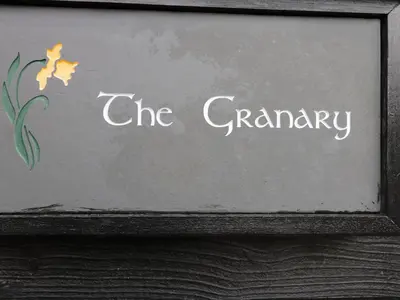 a sign that says the granny on a wall at The Granary in Hereford