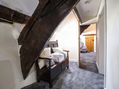 a bedroom with a bed in a room at Cwm Yr Afon Mawr in Llanbedr
