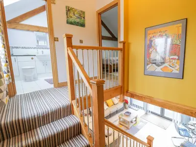 an overhead view of a staircase in a house at 7evern Porth Farm in Caersws