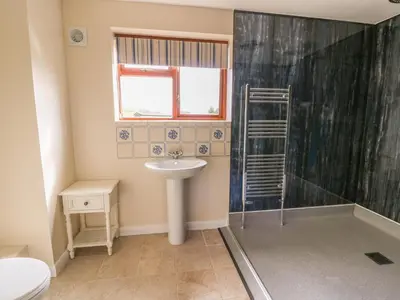 a bathroom with a sink and a shower at Treboeth in Knighton