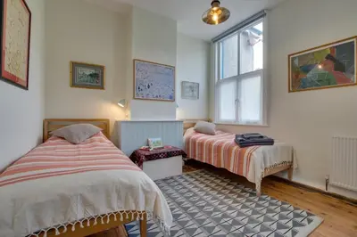 a bedroom with two beds and a window at 3 Bed in Aberystwyth oc-bow115 in Aberystwyth