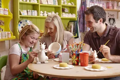 a family sitting at a table playing with toy rabbits at 3 Bed in Machynlleth oc-bow91 in Penegoes