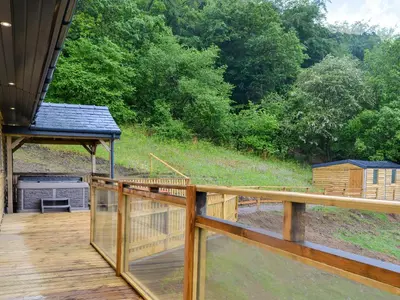 a deck with a view of a bird house at Offa's Dyke Lodge - Uk10835 in Old Radnor