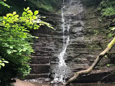a waterfall on the side of a rock cliff at Offa's Dyke Lodge - Uk10835 in Old Radnor