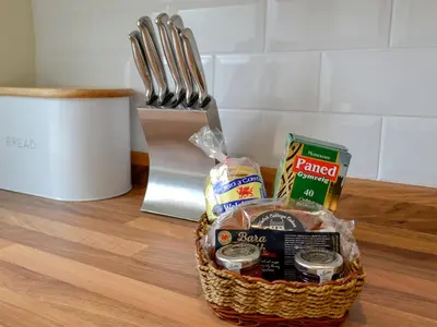 a basket filled with food sitting on a table at Gwynt Y Môr in Tywyn