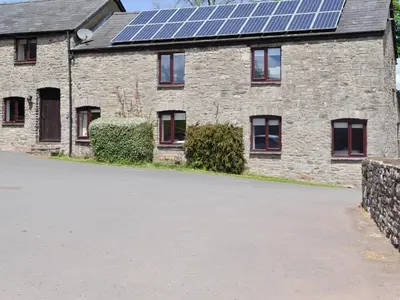 a house with solar panels on the roof at Mountain View-Uk11825 in Llandefaelogfâch