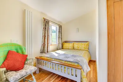 a small bedroom with a bed and a chair at 1 Bed in Lower Chapel oc-waa396 in Lower Chapel