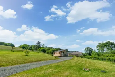 a gravel road leading to a house in a field at 1 Bed in Lower Chapel oc-waa396 in Lower Chapel