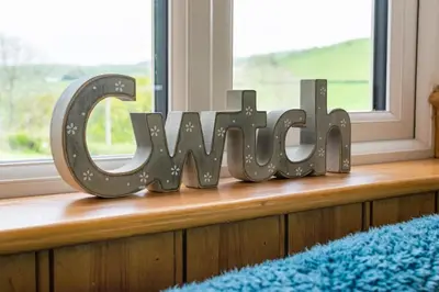 a window sill with a sign that says smile at 1 Bed in Lower Chapel oc-waa906 in Lower Chapel