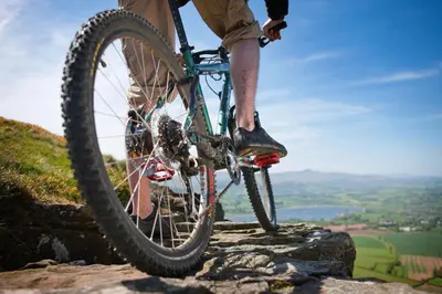 a man riding a bike on top of a mountain at 1 Bed in Lower Chapel oc-waa906 in Lower Chapel