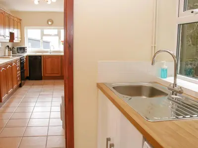 a kitchen with a sink and a counter at Caesamson in Caersws