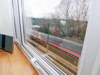 a window with a view of a train at Ty'r Orsaf in Builth Wells