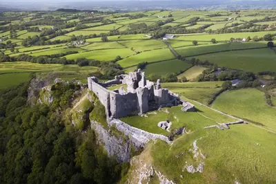 an old castle on a hill in a green field at 2 Bed in Crugybar oc-waw323 in Llansawel