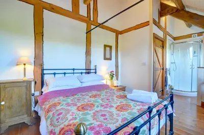 a bedroom with a large bed in a room at 2 Bed in Crugybar oc-waw324 in Llansawel