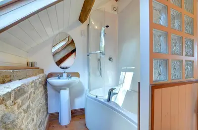 a bathroom with a sink and a tub and a toilet at 2 Bed in Crugybar oc-waw324 in Llansawel