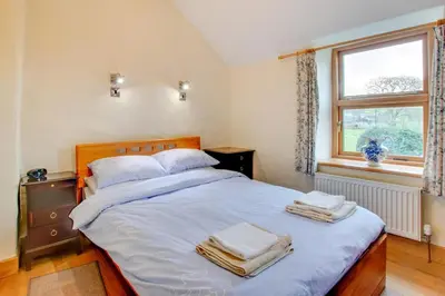 a bedroom with a bed with towels on it at 3 Bed in Dolgellau oc-wah464 in Llanfachreth