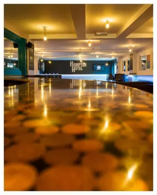 a dance floor in a gym with lights on it at Hampton Hotel & restaurant in Llandrindod Wells