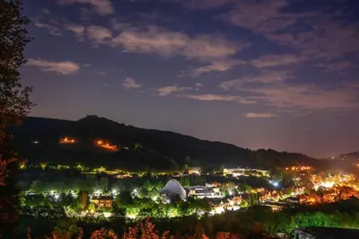 a view of a town at night with lights at Llangollen Shepherds Huts in Llangollen