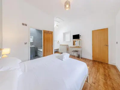 a white bedroom with two beds and a desk at Ty Felin - Uk12744 in Acrefair