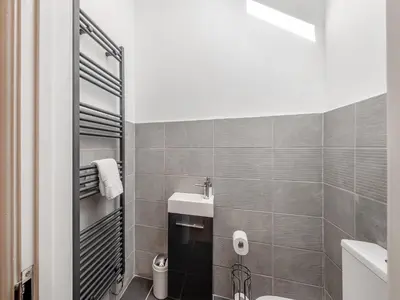 a bathroom with a toilet and a sink at Y Stabl - Uk12742 in Acrefair